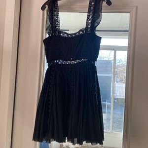 Free people, size small.  Boho chic.  Intricate lace detail.  Pretty straps.